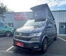 Indium Grey Campervan with poptop roof up parked in front of CamperKing Scotland Showroom