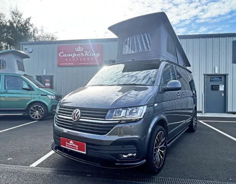 Indium Grey Campervan with poptop roof up parked in front of CamperKing Scotland Showroom