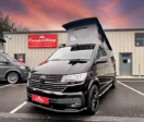 Deep Pearl Black Campervan parked in front of CamperKing Scotland showroom in Falkirk