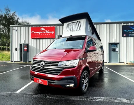 Fortana Red CamperKing campervan parked in front of CamperKing Scotland showroom with poptop roof up