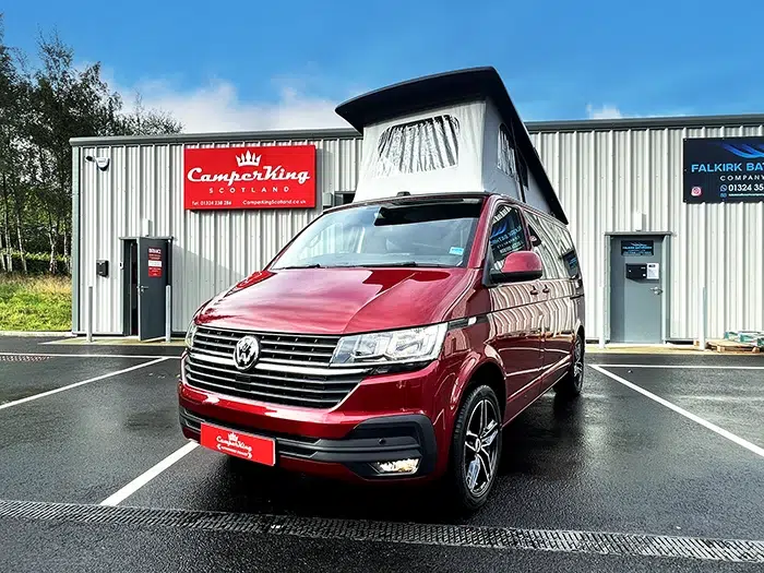 Fortana Red CamperKing campervan parked in front of CamperKing Scotland showroom with poptop roof up