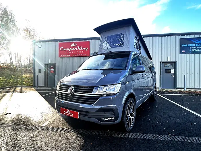 Pure Grey Highline LWB DSG CamperKing campervan parked in front of the CamperKing Scotland show room with the pop top roof up.